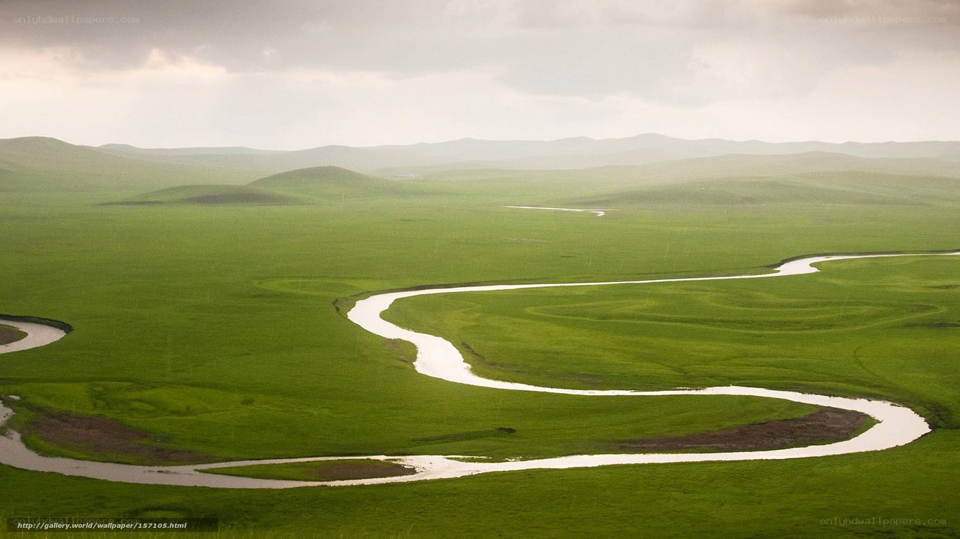 Winding river through green plains