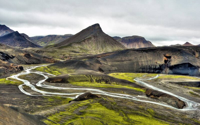 Winding river through volcanic landscape