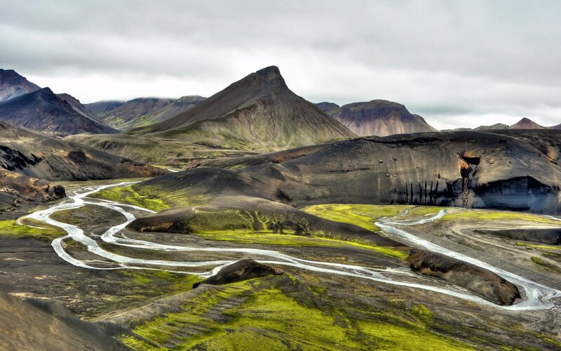 Winding river through volcanic landscape