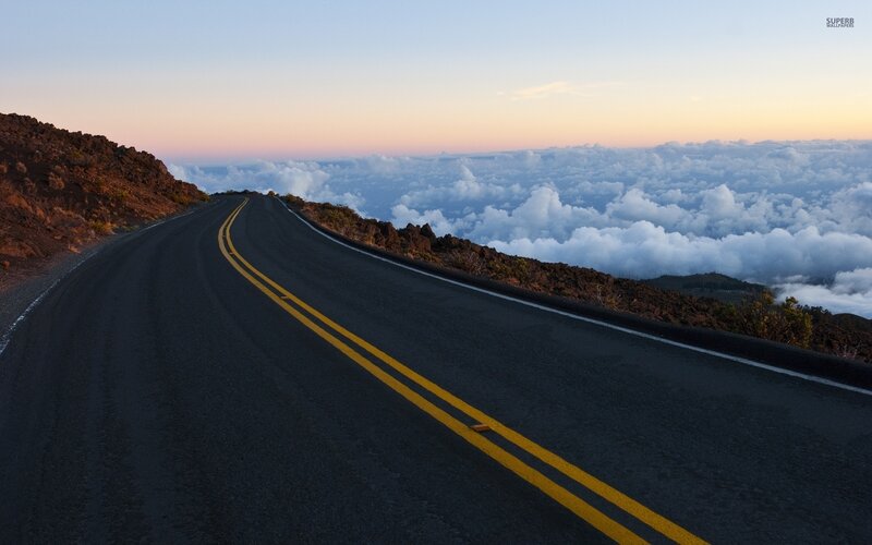 Winding Road Above Clouds