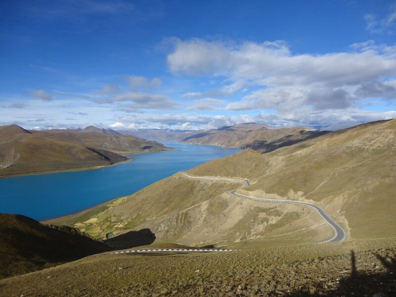 Winding road along a mountain lake