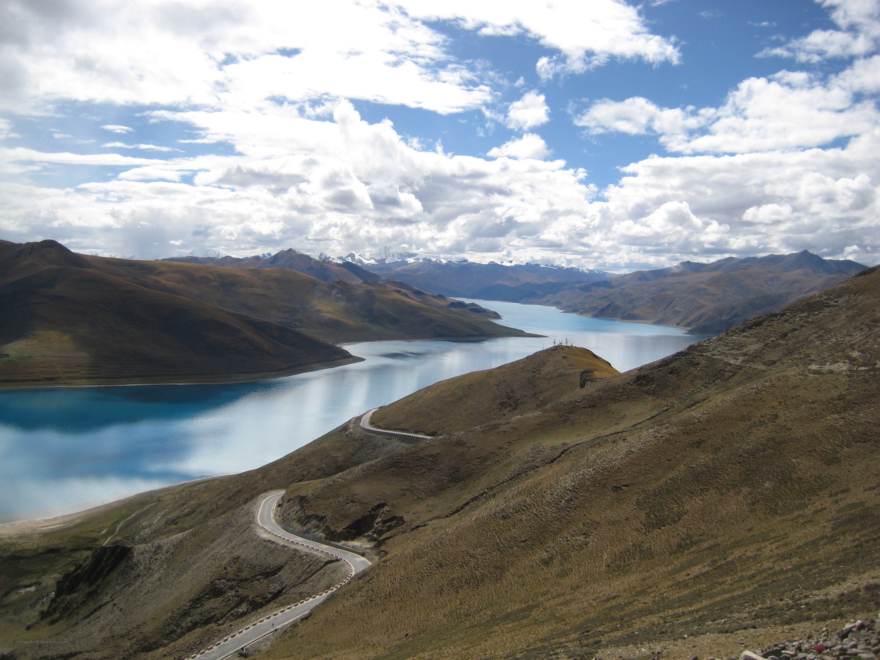Winding road along a mountain lake