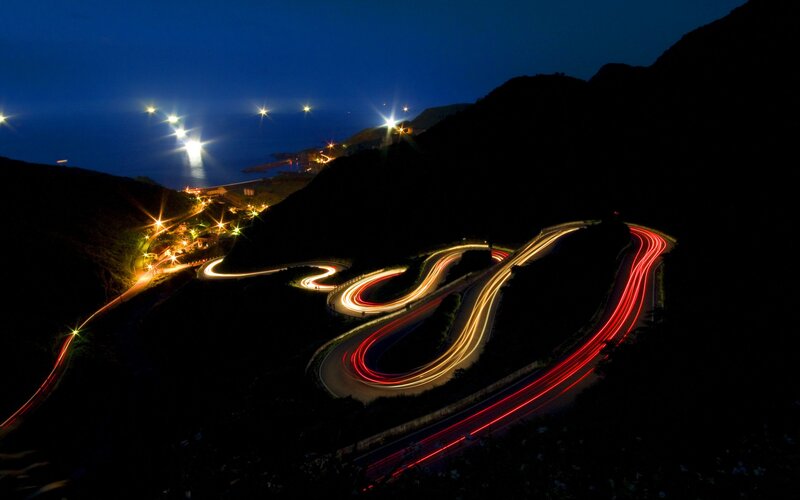 Winding Road at Night — Black, Dramatic, Photograph, Mountain, Sea, Lights