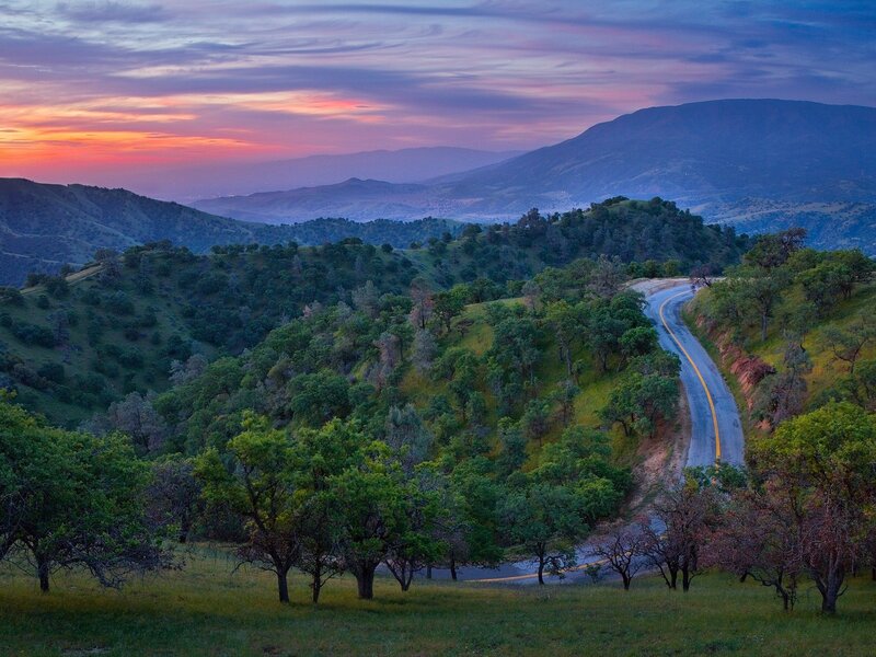 Winding road at sunset in the hills