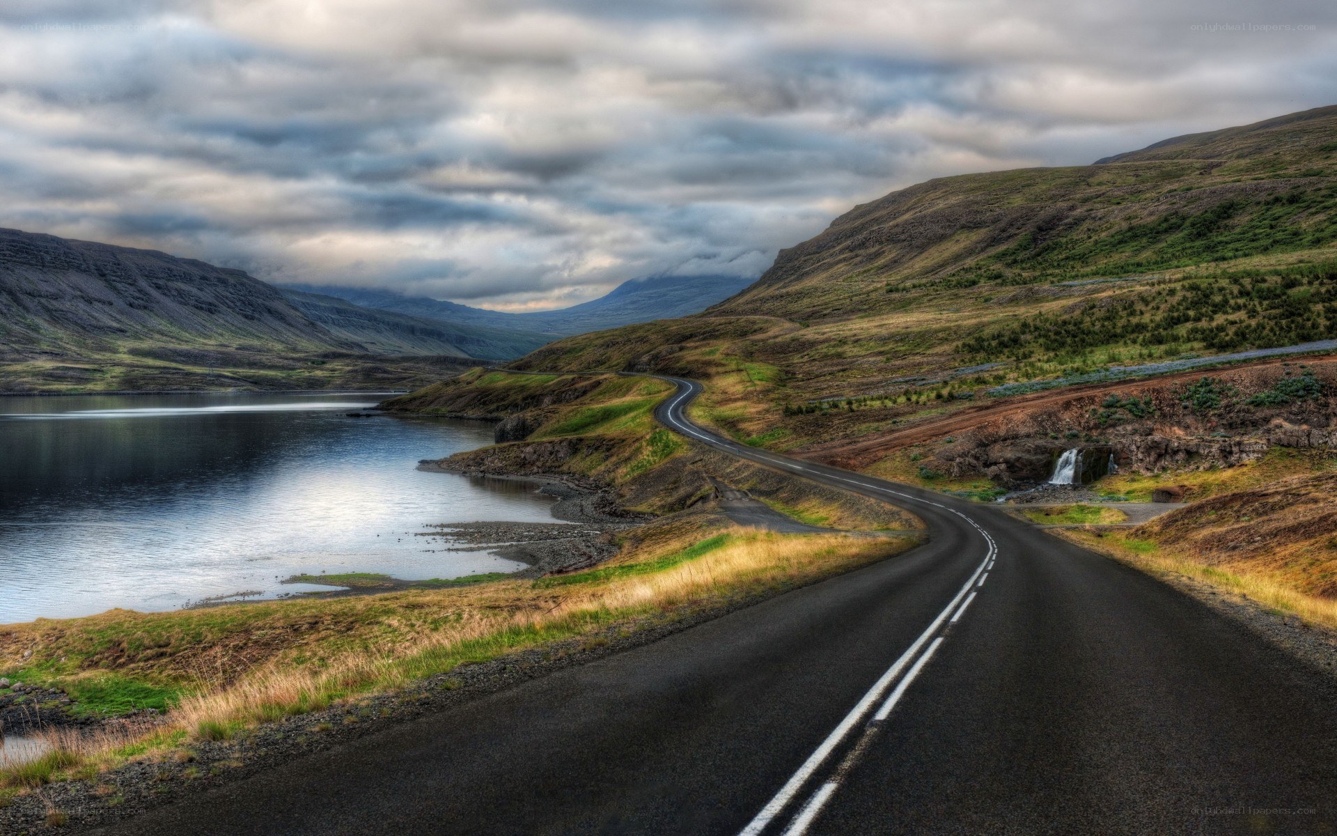 Winding road by a lake