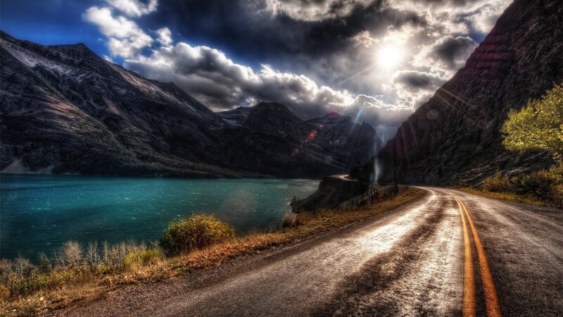 Winding Road by Lake — Blue, Dramatic, Afternoon, Photograph, Mountains