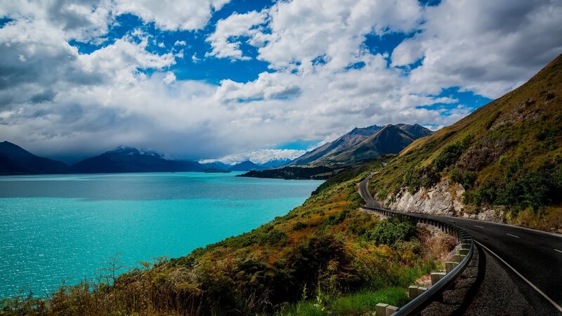 Winding Road by Lake — Blue, Dramatic, Afternoon, Photograph