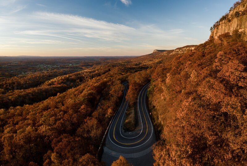 Winding Road in Autumn Forest — Orange, Serene, Photograph, Cliff