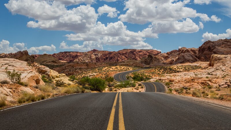 Winding Road in Desert — Blue, Serene, Afternoon, Photograph, Rock Formations