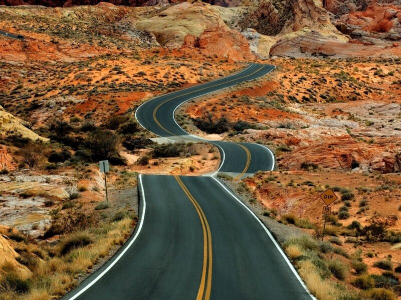 Winding Road in Desert — Red, Arid, Afternoon, Photograph, Signs