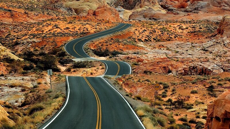 Winding Road in Desert — Red, Arid, Afternoon