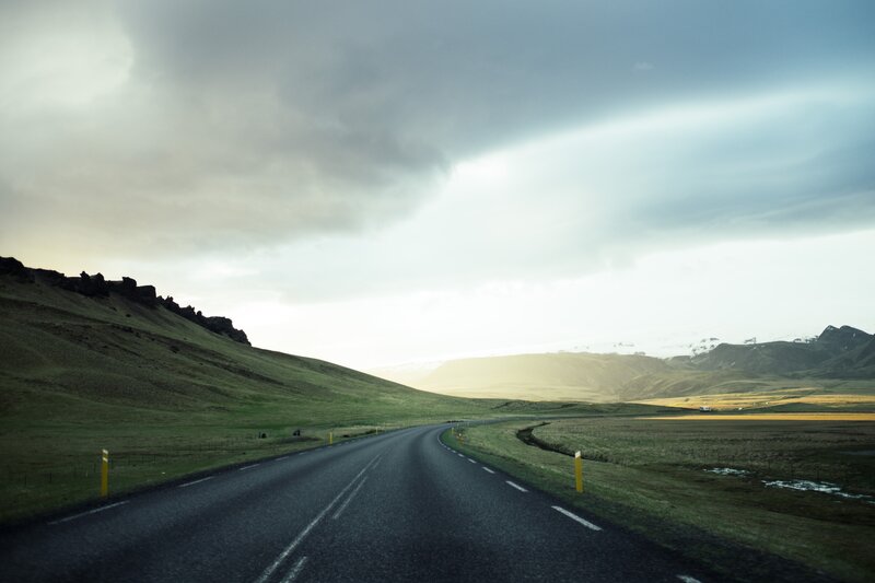 Winding Road in Green Hills — Dramatic