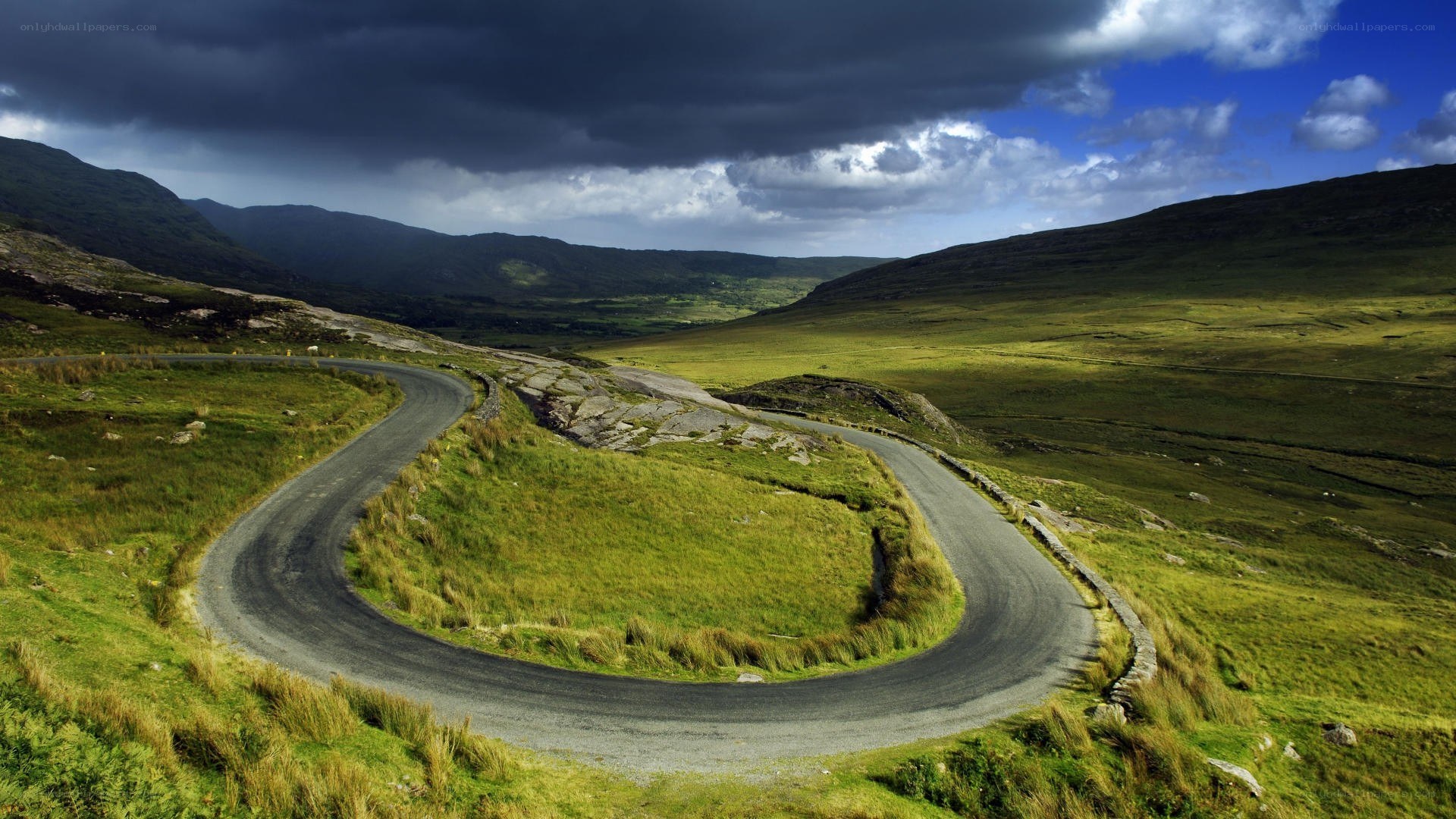 Winding road in green valley