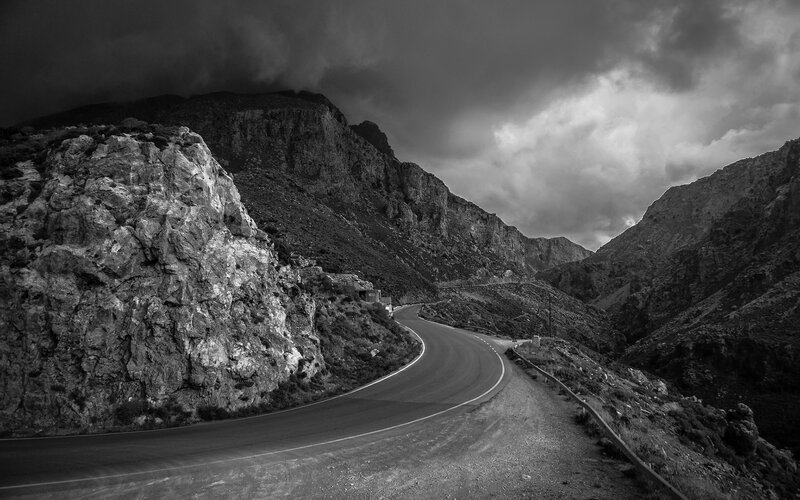 Winding Road in Mountains — Black, Dramatic, Photograph, Clouds