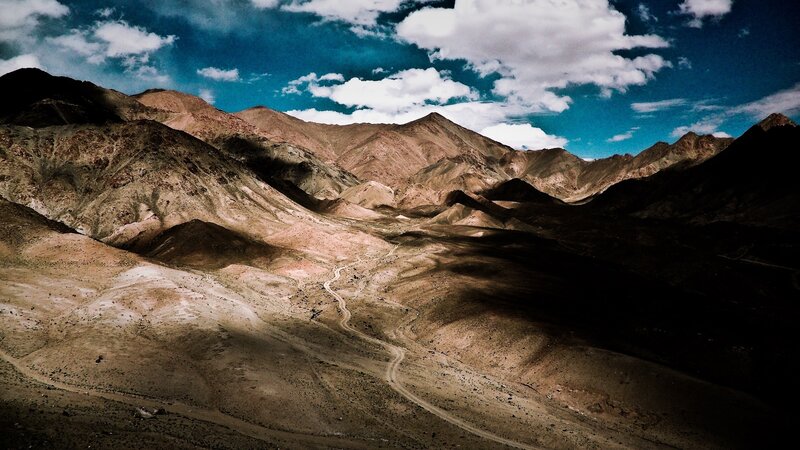 Winding Road in Mountains — Blue, Dramatic, Afternoon, Photograph, Sky