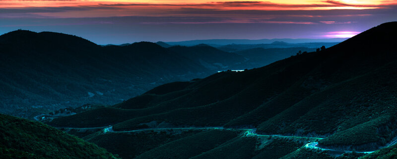 Winding Road in Mountains — Blue, Dramatic, Sunset, Photograph, Sky
