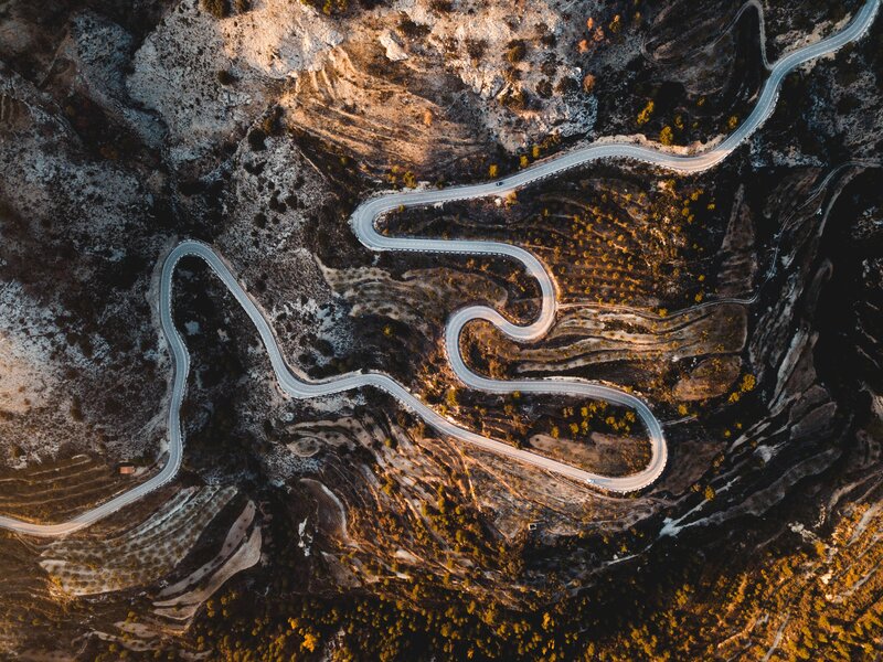 Winding Road in Mountains — Brown, Dramatic, Sunset