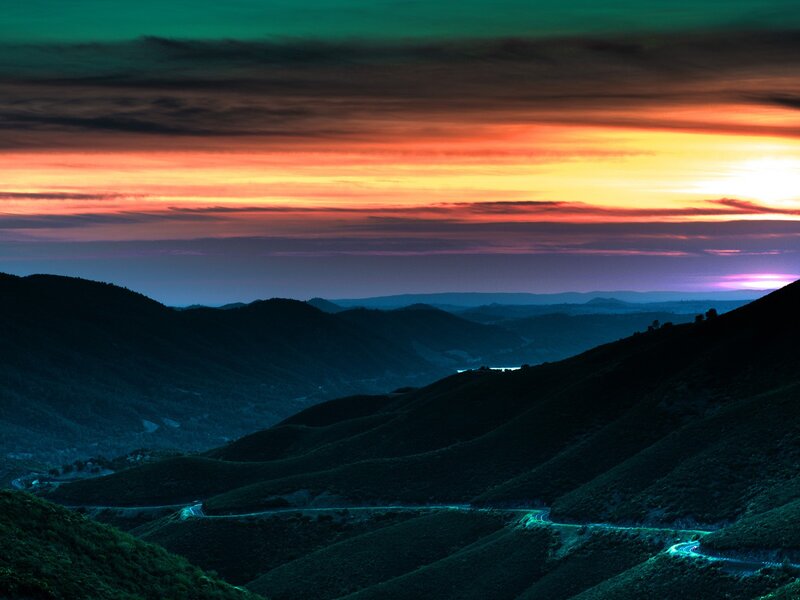 Winding Road in Mountains — Green, Dramatic, Sunset, Photograph, Sky