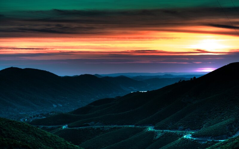 Winding Road in Mountains — Orange, Dramatic, Sunset, Photograph, Sky