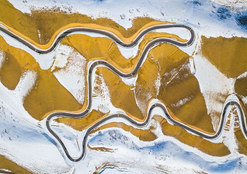 Winding Road in Snow — White, Serene, Winter
