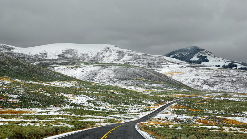 Winding Road in Snowy Mountains