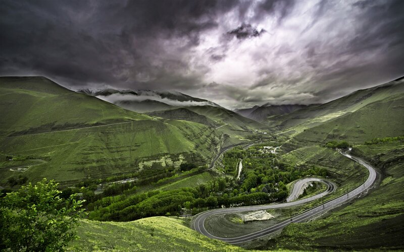 Winding Road in Valley — Green, Dramatic, Photograph, Mountains