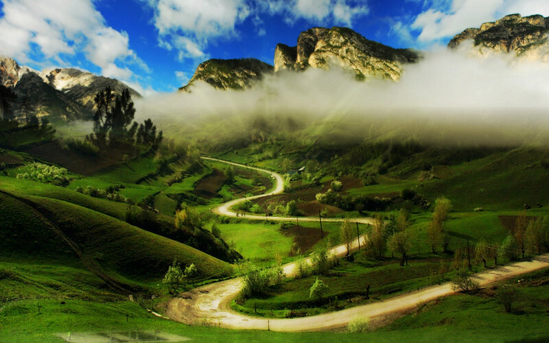 Winding Road in Valley — Green, Serene, Morning, Photograph, Mountains