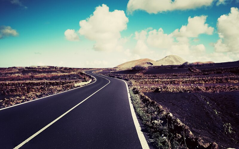 Winding Road in Volcanic Landscape — Blue