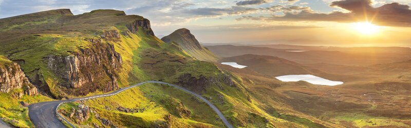 Winding Road on Green Hills — Serene, Sunset