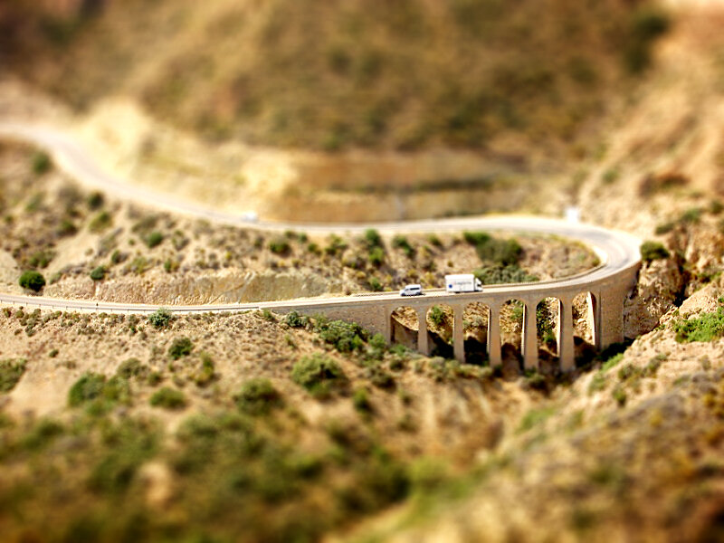 Winding road over bridge