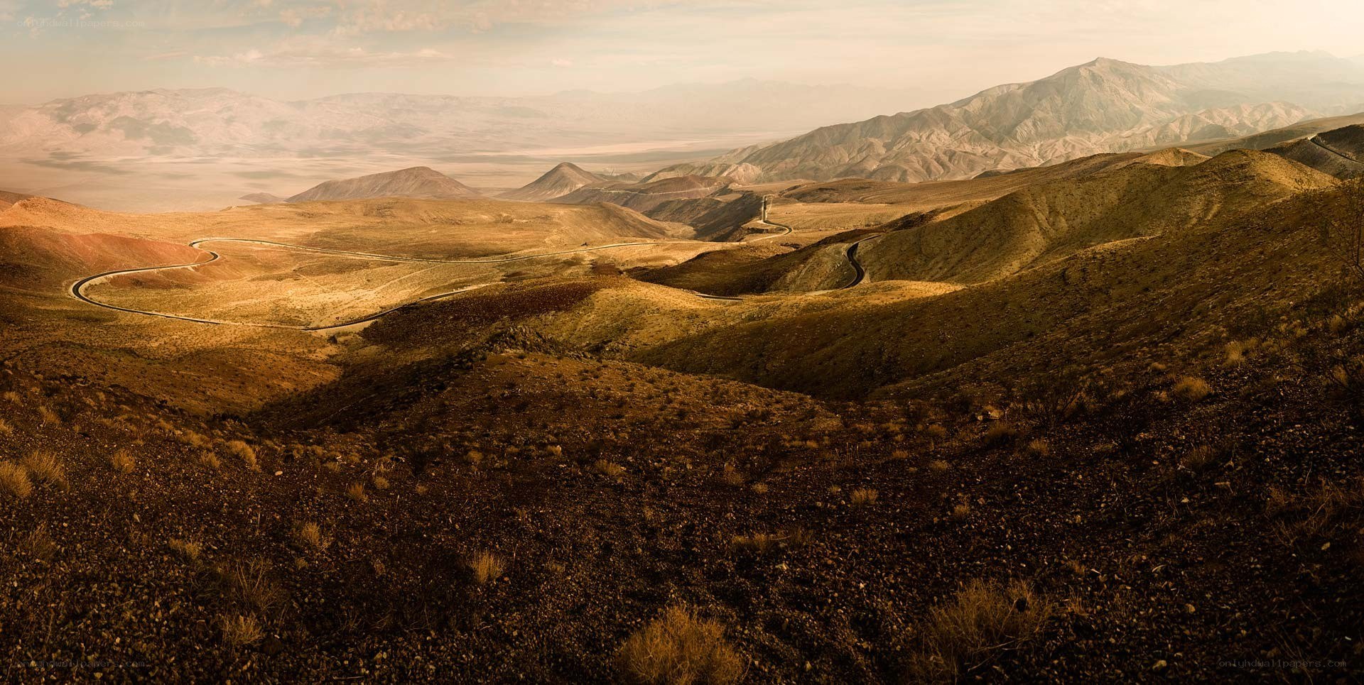 Winding road through desert hills