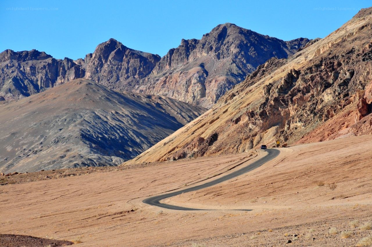 Winding road through desert mountains