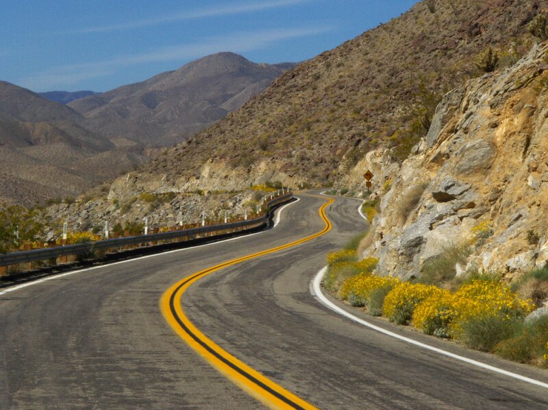 Winding road through desert mountains