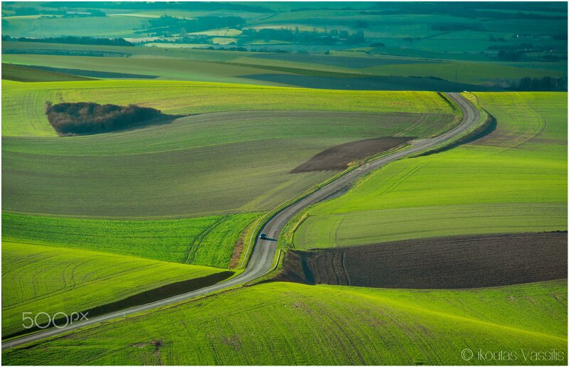 Winding Road Through Fields — Green, Serene, Afternoon, Photograph, Car
