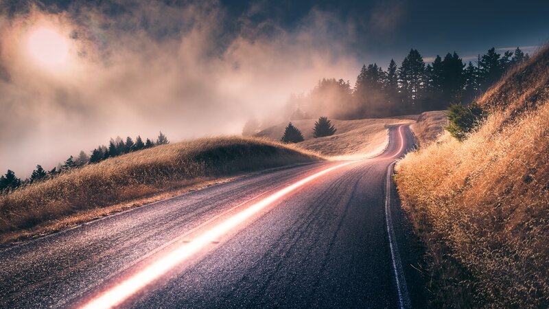 Winding Road Through Fog