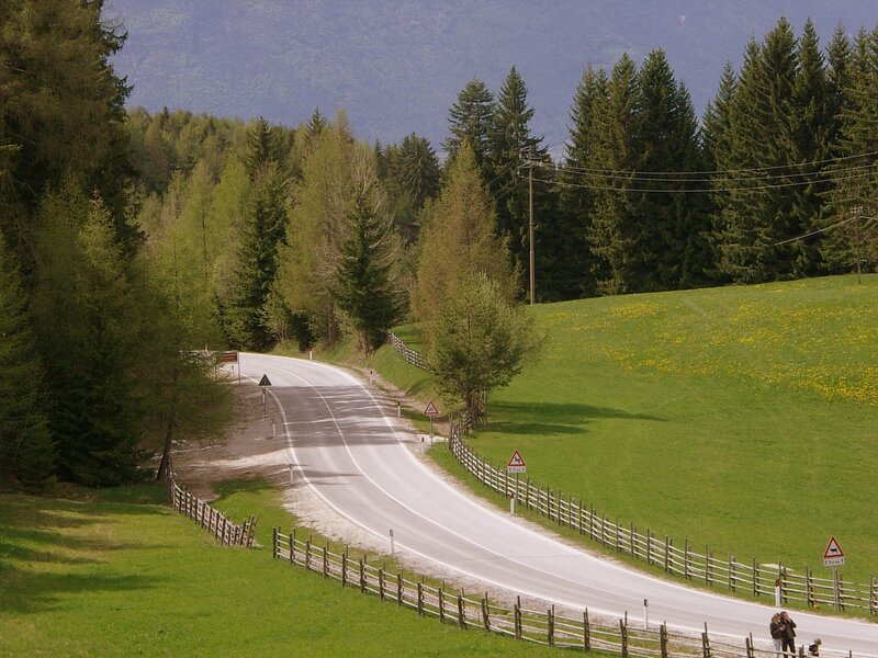 Winding road through forested hills