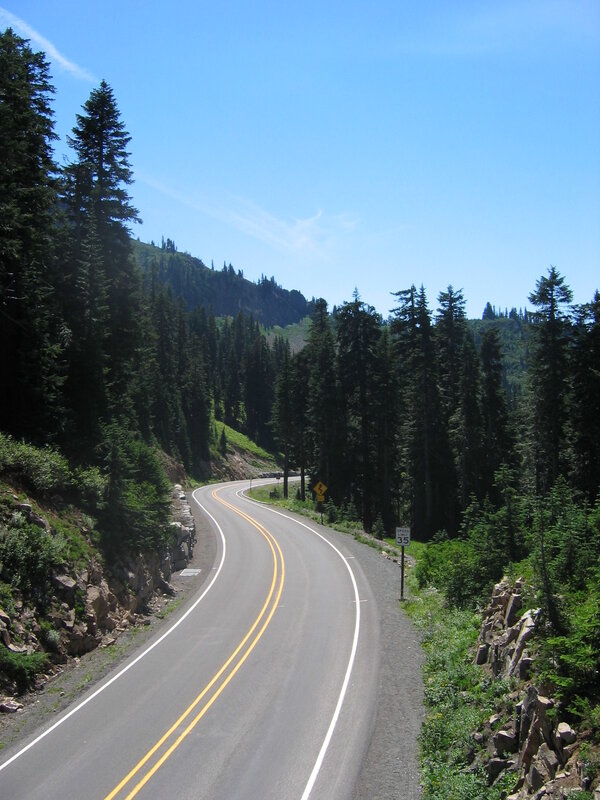 Winding road through forested mountains