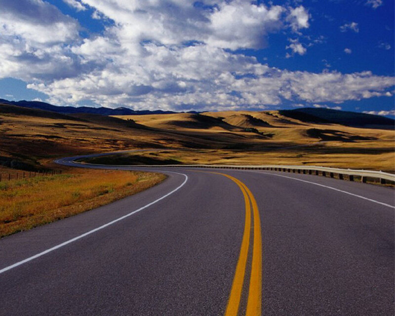 Winding road through golden hills