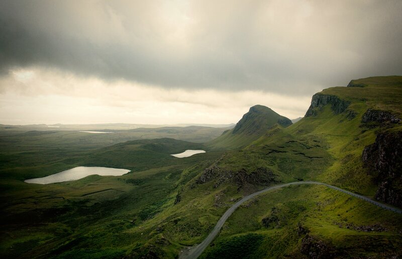 Winding road through green hills
