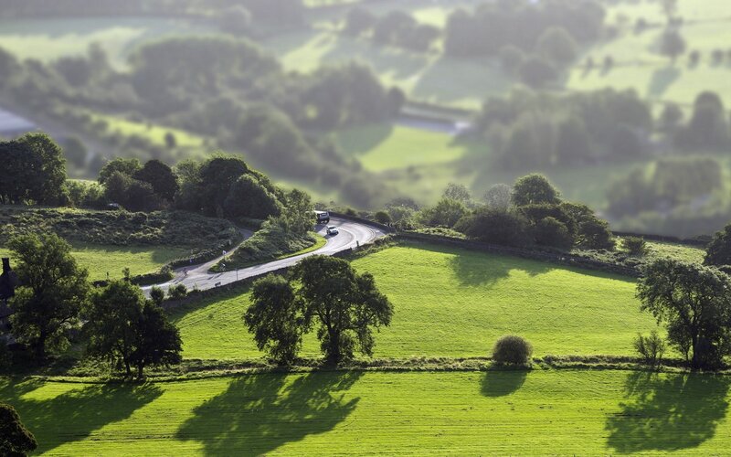 Winding Road Through Green Hills — Serene, Afternoon