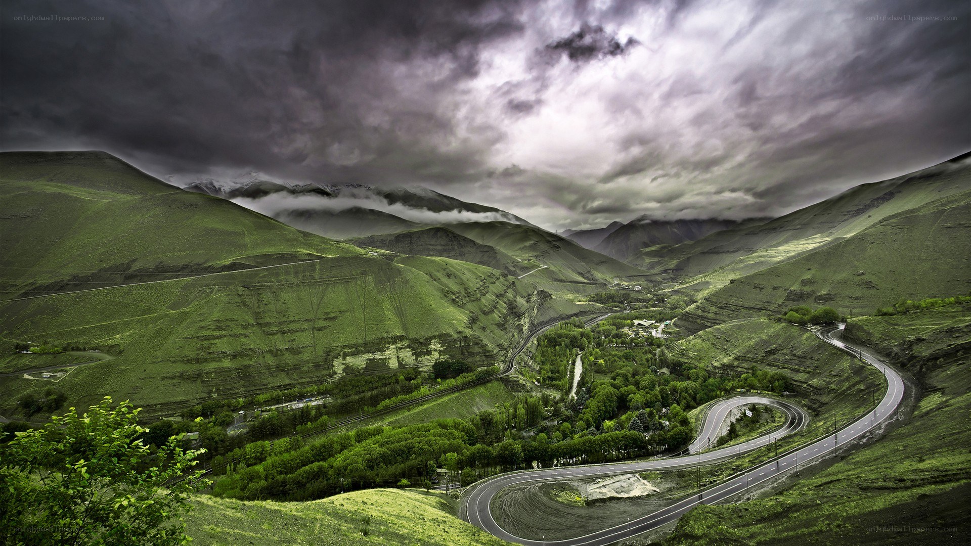 Winding road through green mountains