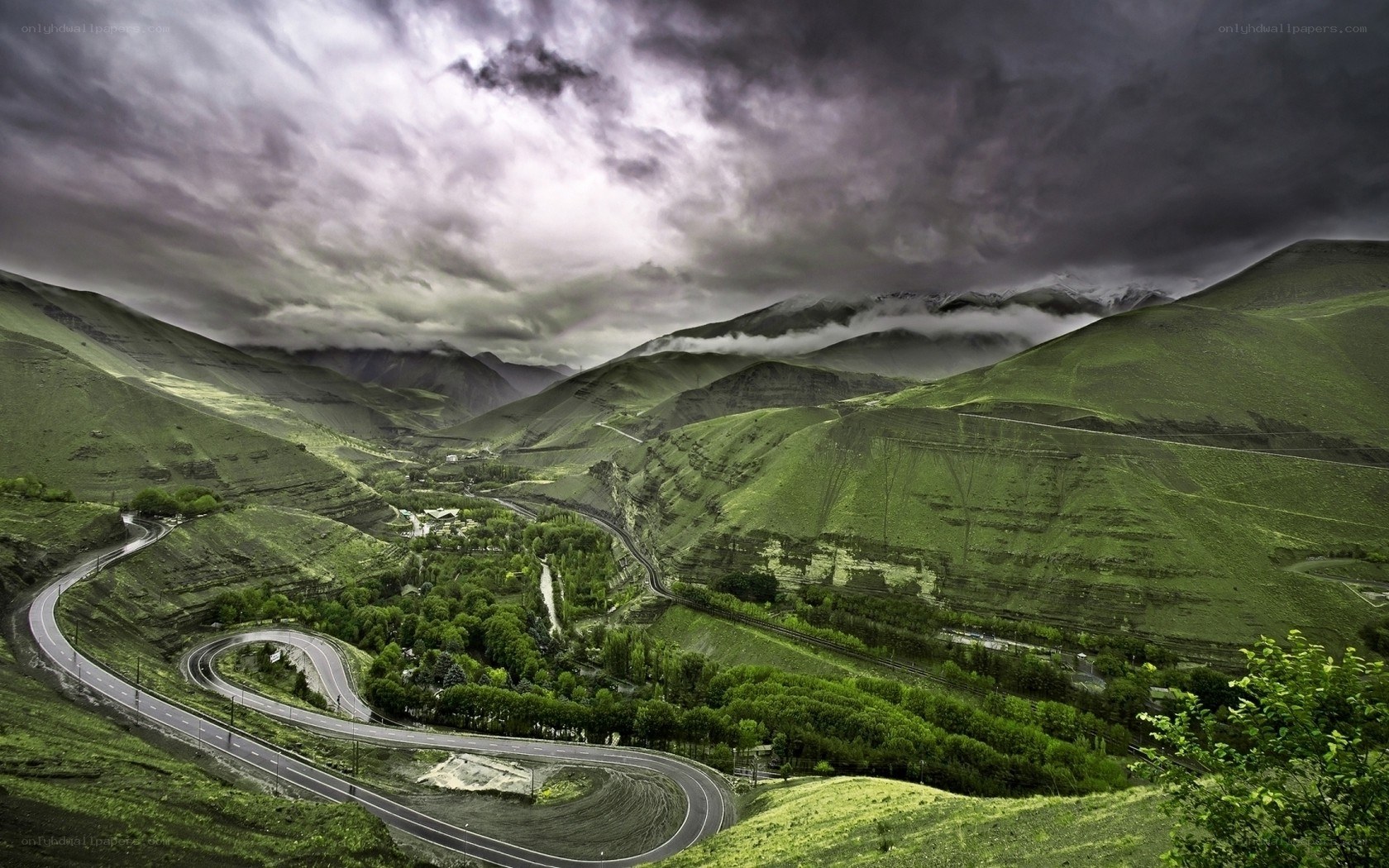 Winding road through green mountains