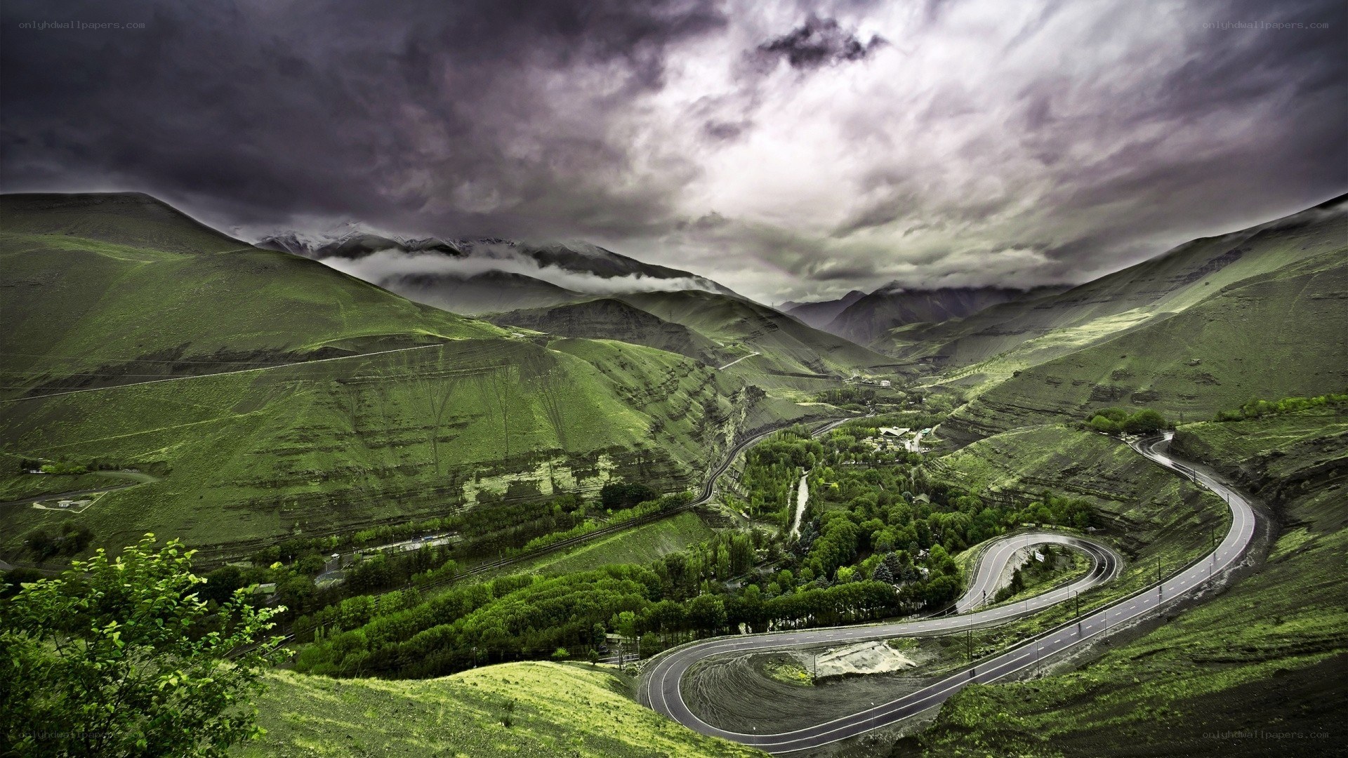 Winding road through green mountains