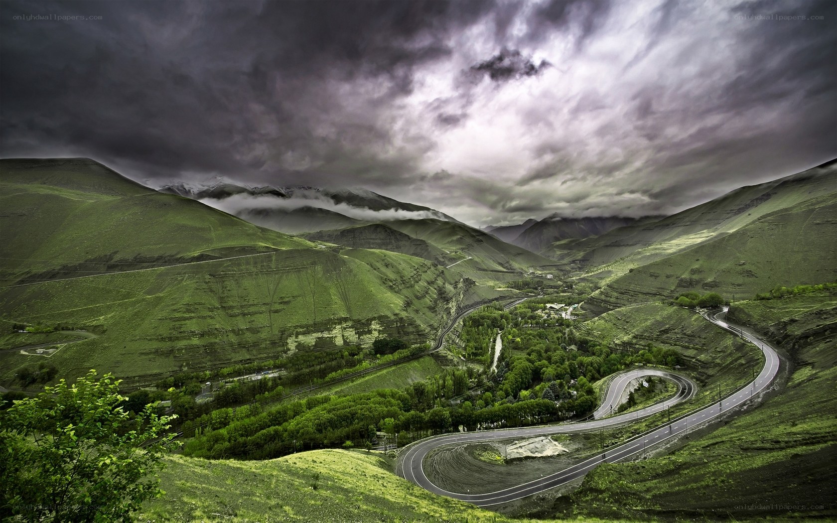 Winding road through green mountains