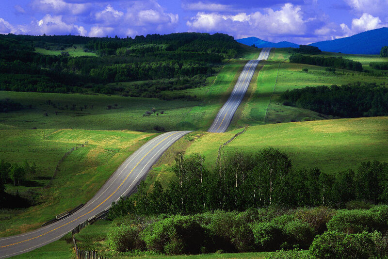 Winding Road Through Hills — Green, Serene, Afternoon, Photograph, Trees, Mountains