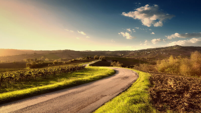 Winding Road Through Hills — Green, Serene, Sunset