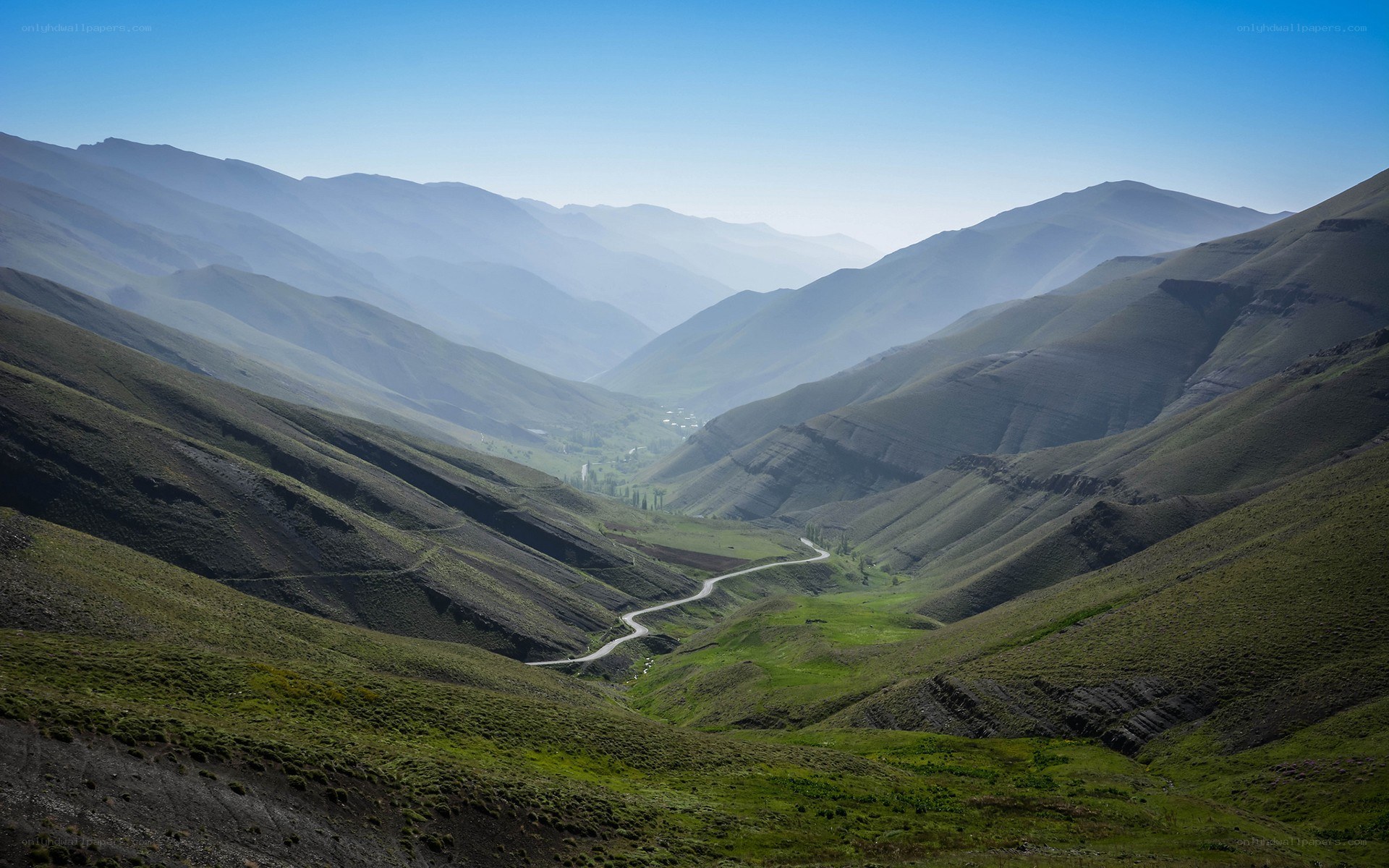 Winding road through mountain valley