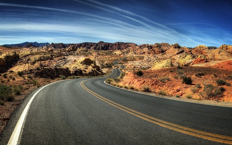 Winding road through red rock canyon
