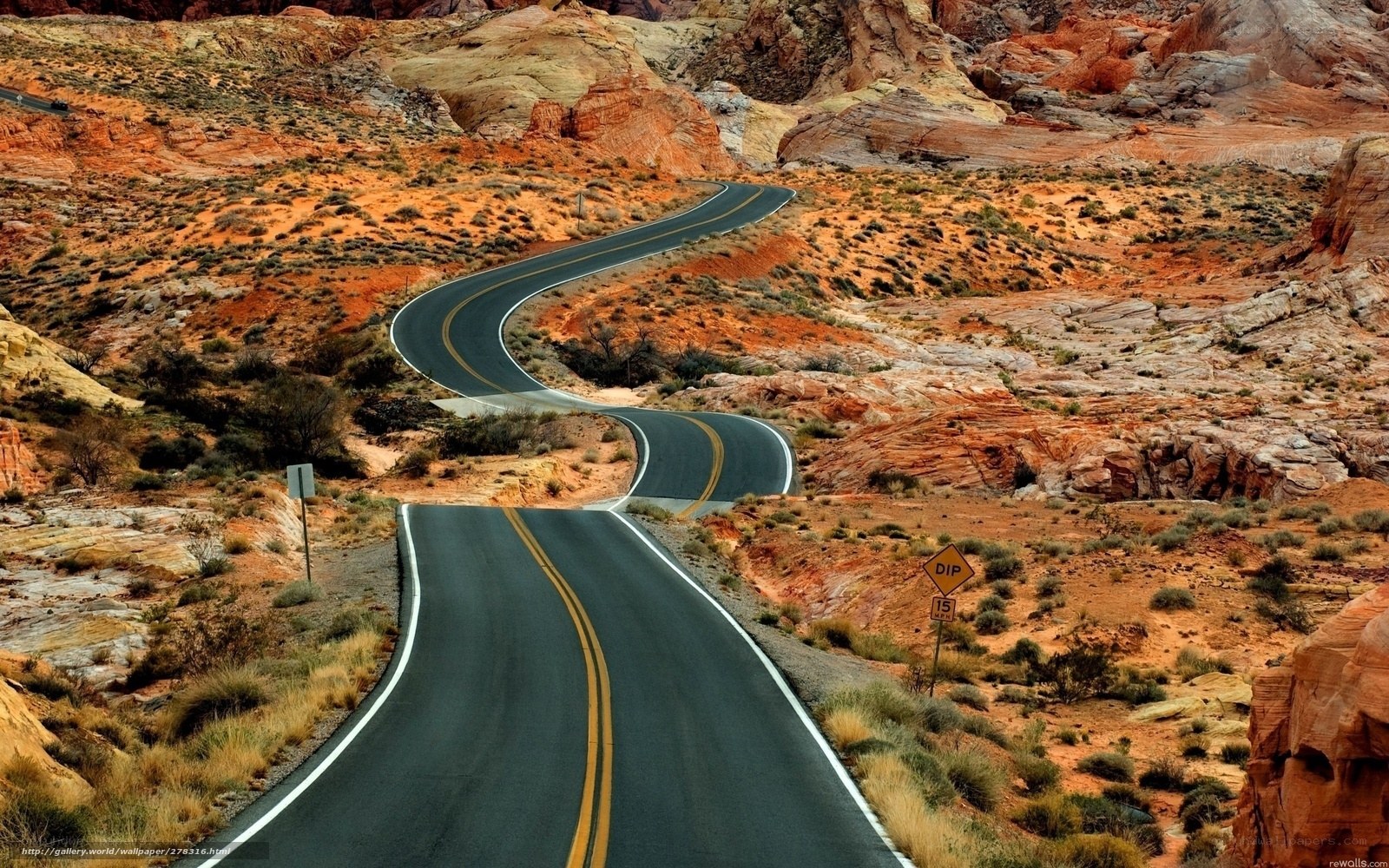 Winding road through red rock canyon