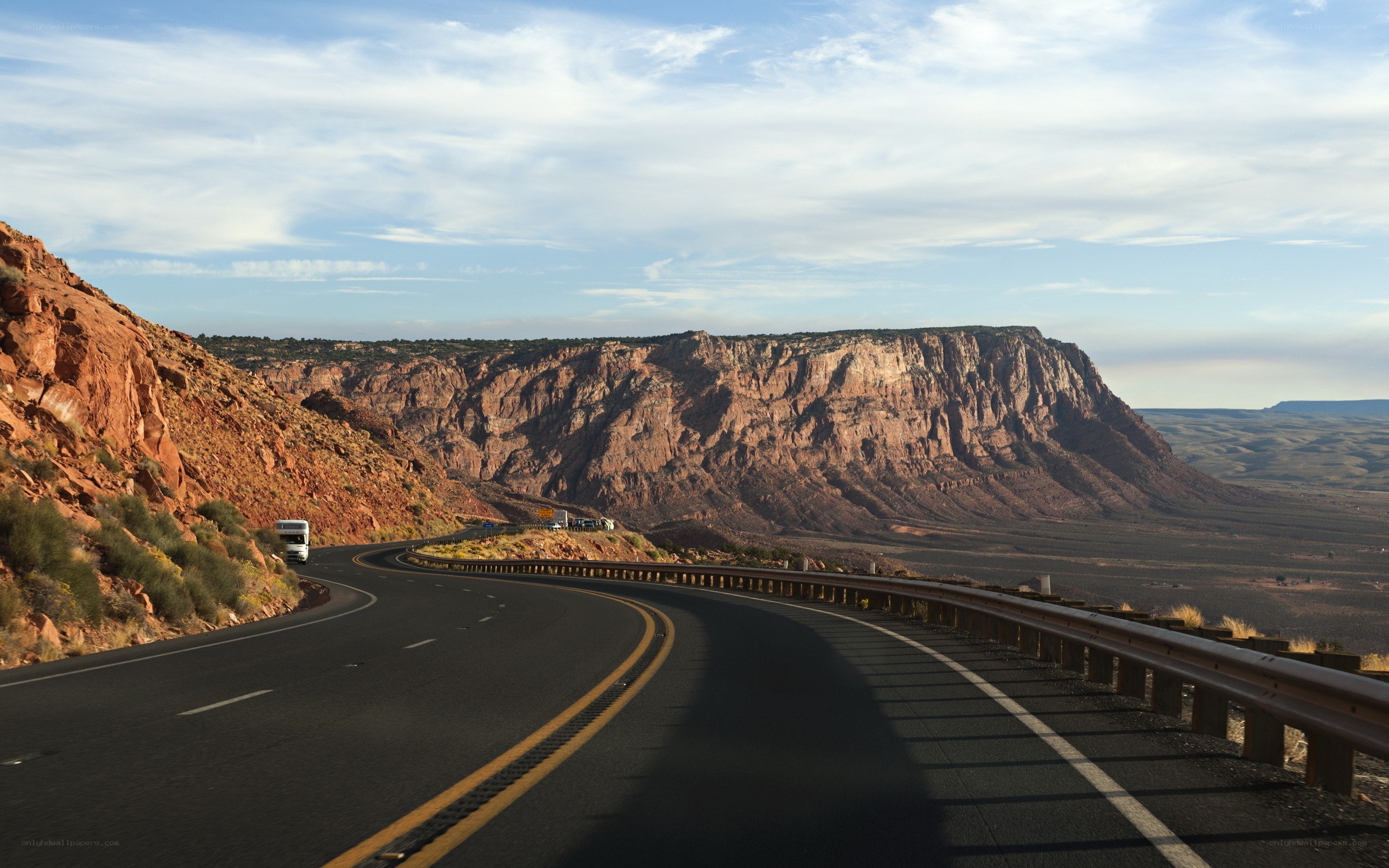 Winding road through red rock canyon